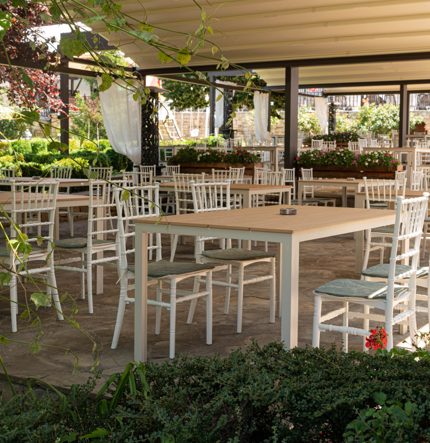 Tables in the summer garden arranged for an event